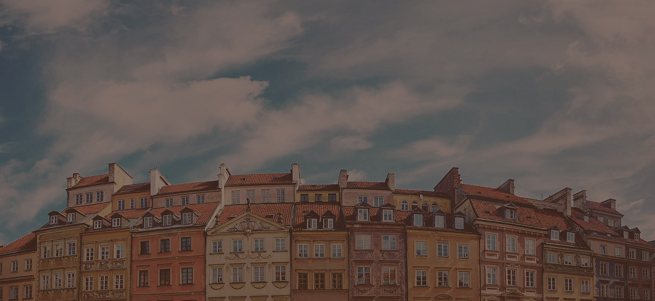 A row of colorful old houses beneath the blue sky.